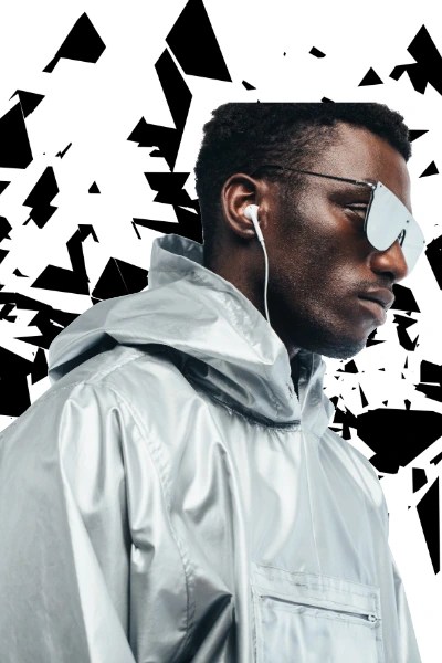 Young athletic model in sports wear sporting shades and ear buds