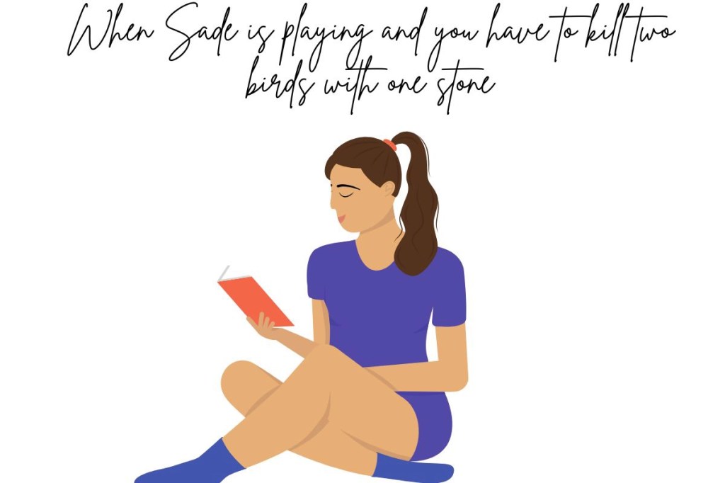 A young woman sitting down reading a book